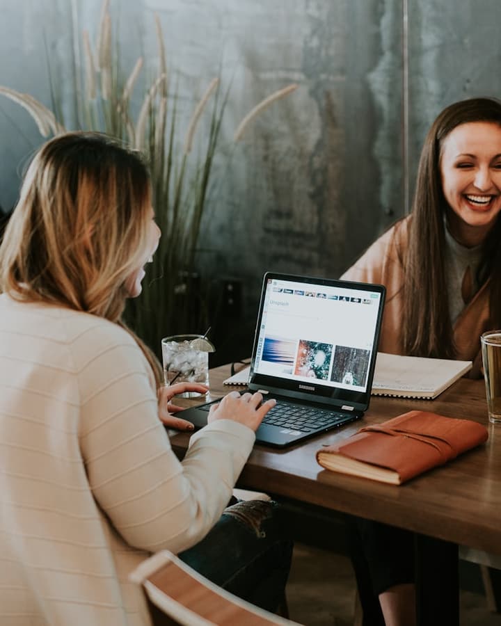 Friends planning together over a laptop